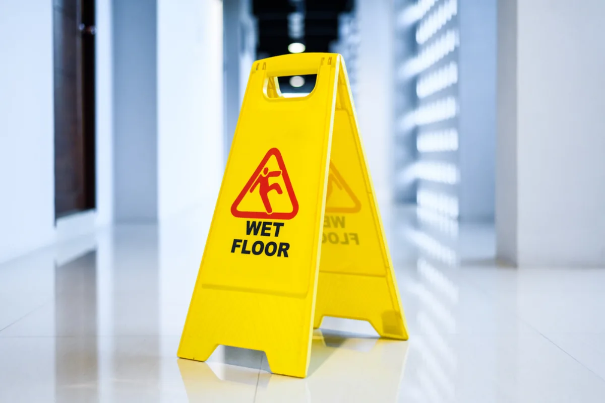 Wet bathroom floor with safety hazard
